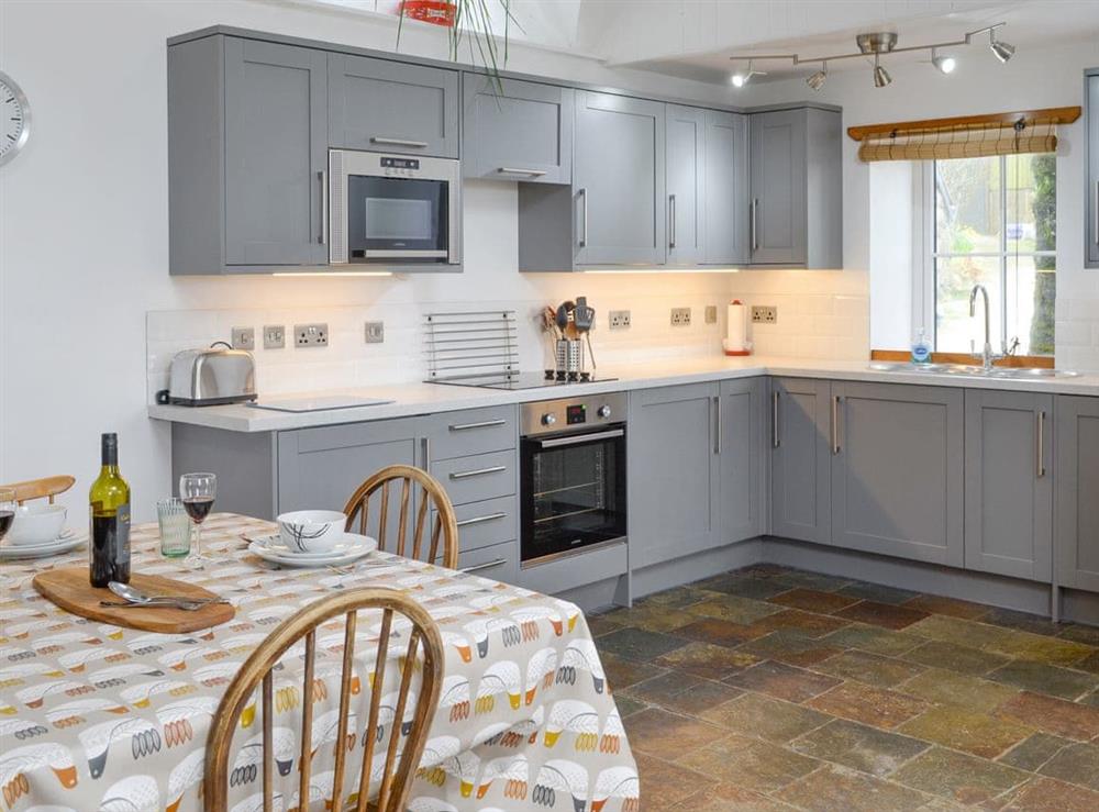 Fully appointed kitchen with dining area at The Old Dye House in Hallin, Isle Of Skye