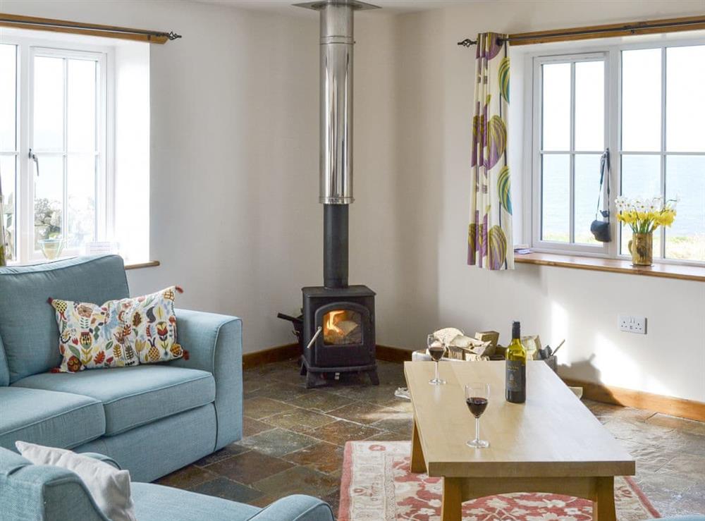 Welcoming living area with wood burner at The Old Dye House in Hallin, Isle Of Skye