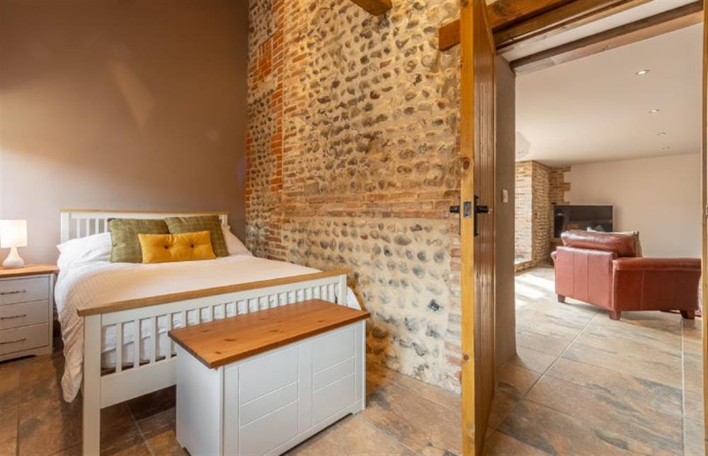 Ground floor: Bedroom three with a double bed  at The Old English Barn and Cart Shed, Paston near North Walsham