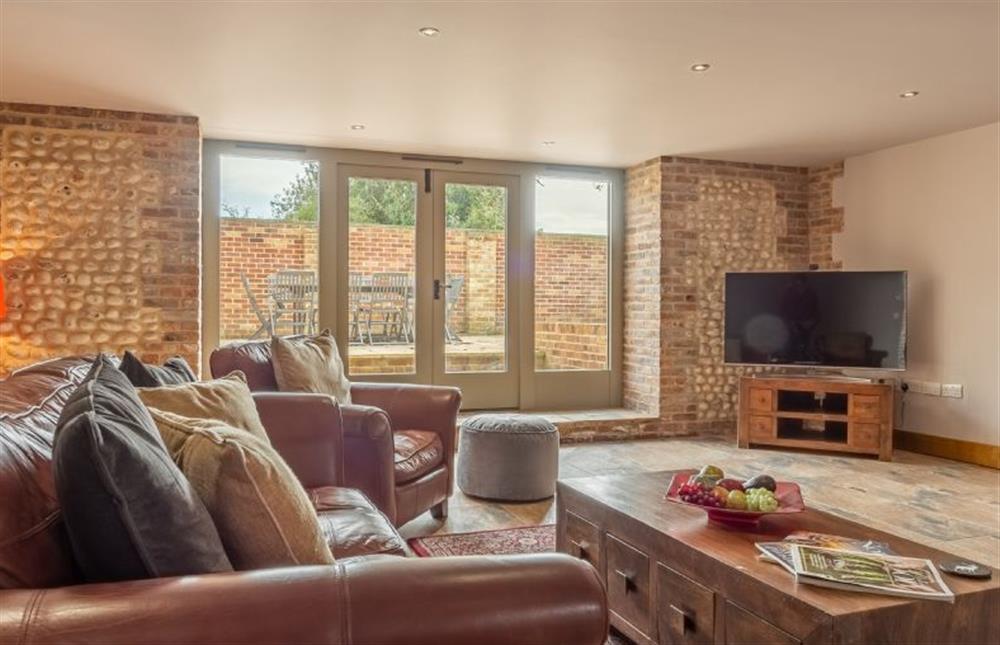 Ground floor: Sitting room with Smart television  at The Old English Barn and Cart Shed, Paston near North Walsham