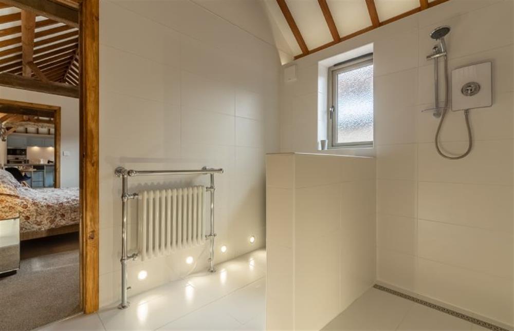 Ground floor: Wet room with large walk-in shower, wash basin and WC at The Old English Barn and Cart Shed, Paston near North Walsham