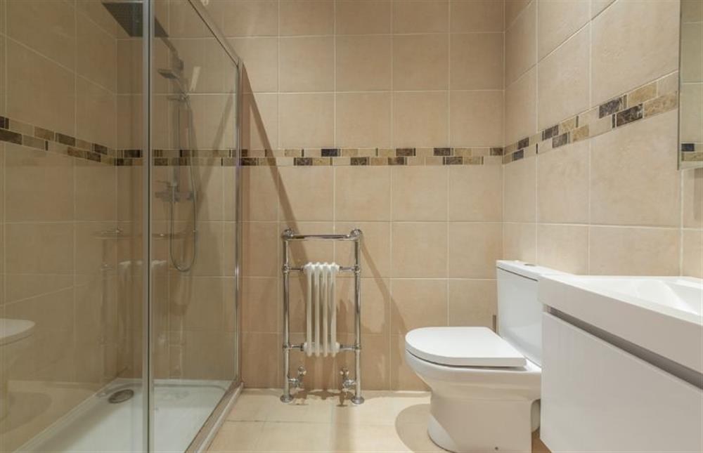 First floor: En-suite shower to bedroom four at The Old English Barn, Paston near North Walsham