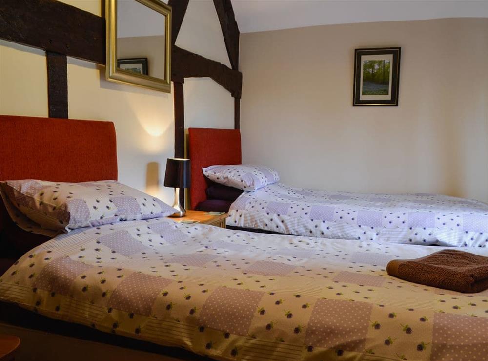 Twin bedroom at The Old Farmhouse in Blakeney, Gloucestershire