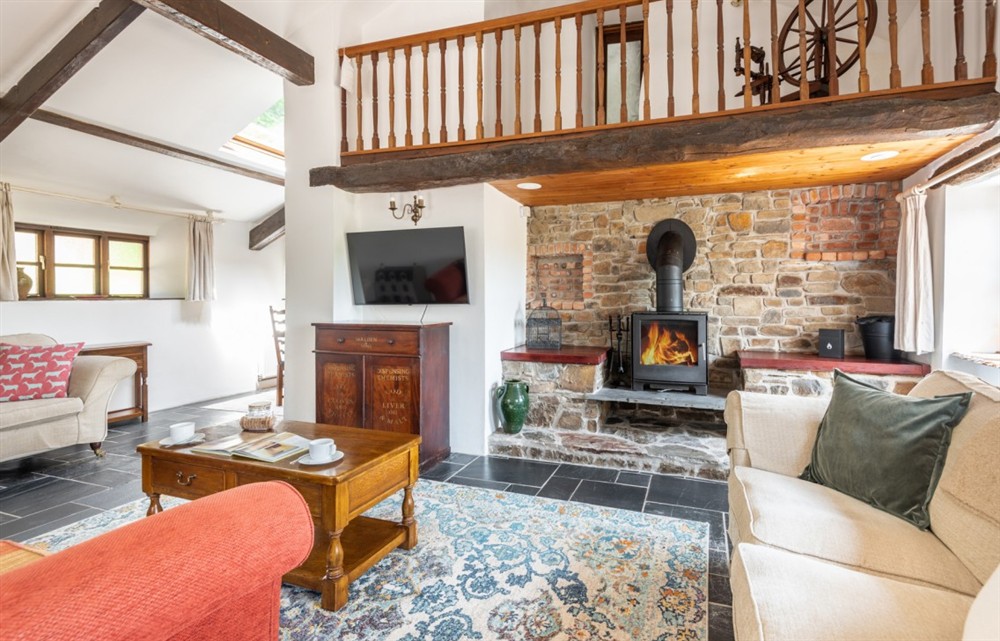 Relax in the living area (photo 5) at The Old Farmhouse in Combe Martin
