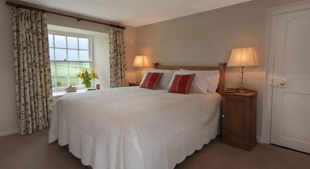 A double bedroom at The Old Farmhouse in Polzeath, Cornwall
