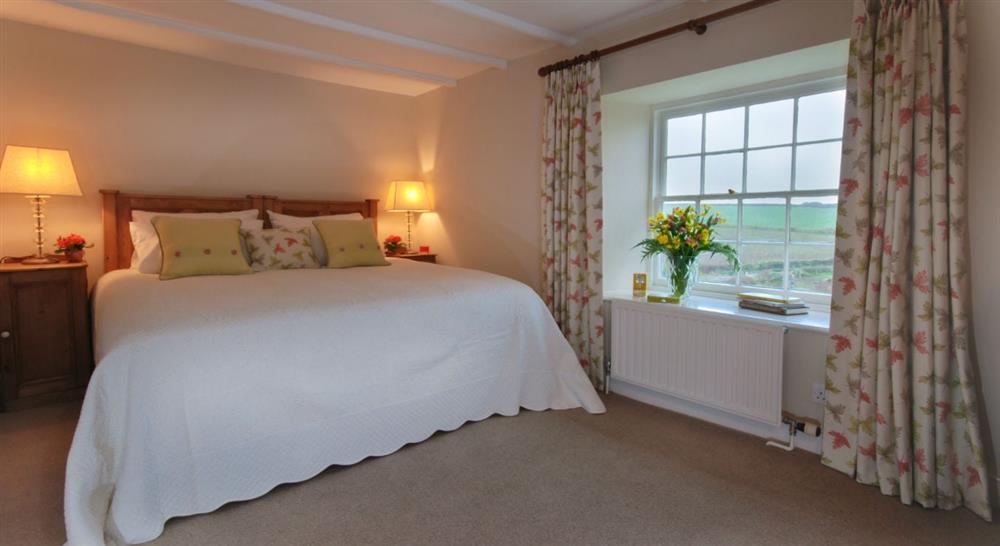 The master bedroom at The Old Farmhouse in Polzeath, Cornwall