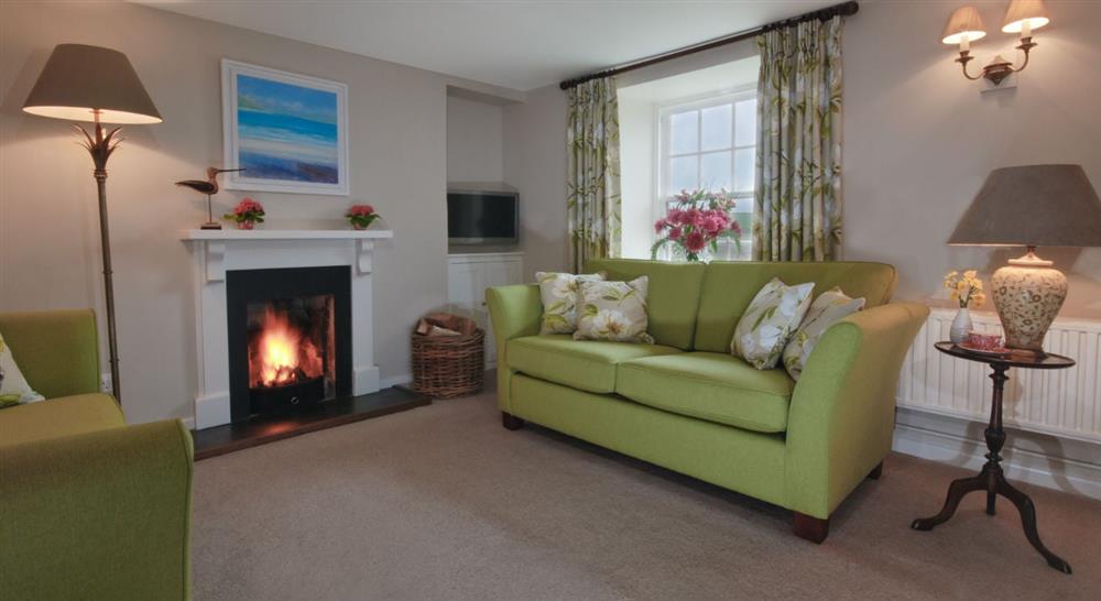 The sitting room at The Old Farmhouse in Polzeath, Cornwall