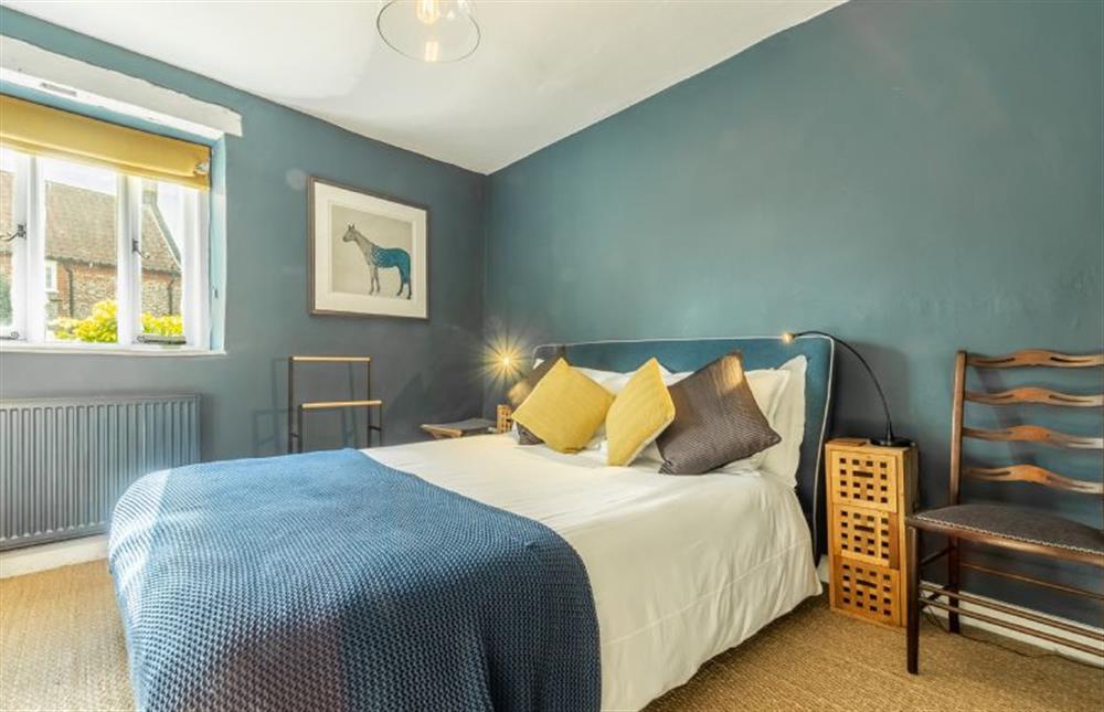 Bedroom two has a king-size bed at The Old Forge, Binham near Fakenham