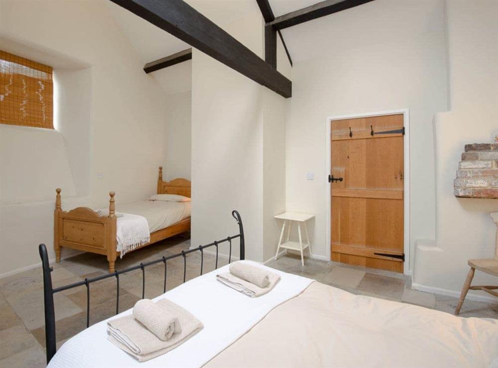 Large, comfortable bedroom with additional single bed at The Old Forge in Kingston, Nr Corfe Castle., Dorset