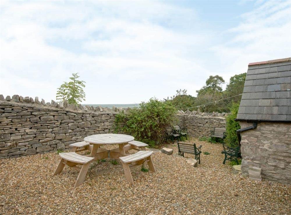 Small courtyard with sitting out areas at The Old Forge in Kingston, Nr Corfe Castle., Dorset
