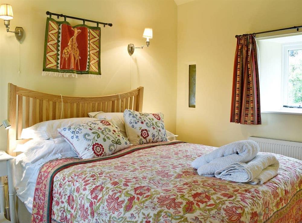 Beautifully presented double bedroom with en-suite shower room at The Old Forge in Lower Wraxall, Nr Dorchester., Dorset