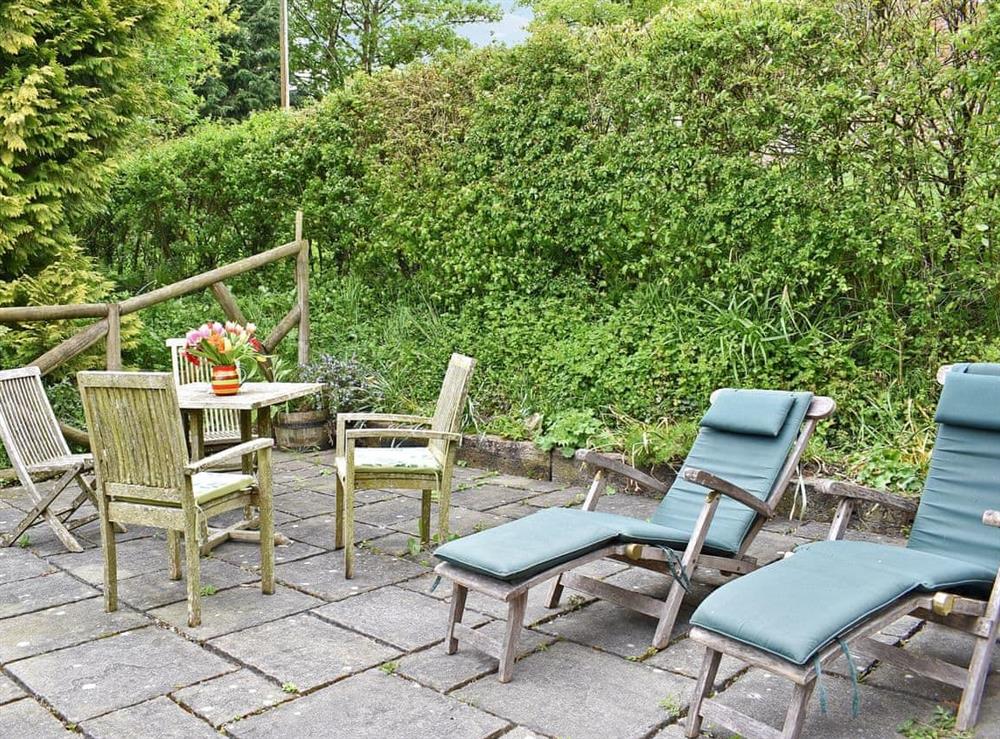 Peaceful garden with terrace and furniture at The Old Forge in Lower Wraxall, Nr Dorchester., Dorset