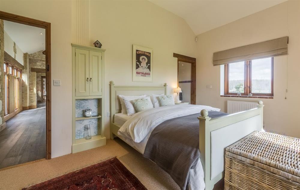 Bedroom with 5’ king size bed and en-suite bathroom at The Old Foundry, Eastmoor