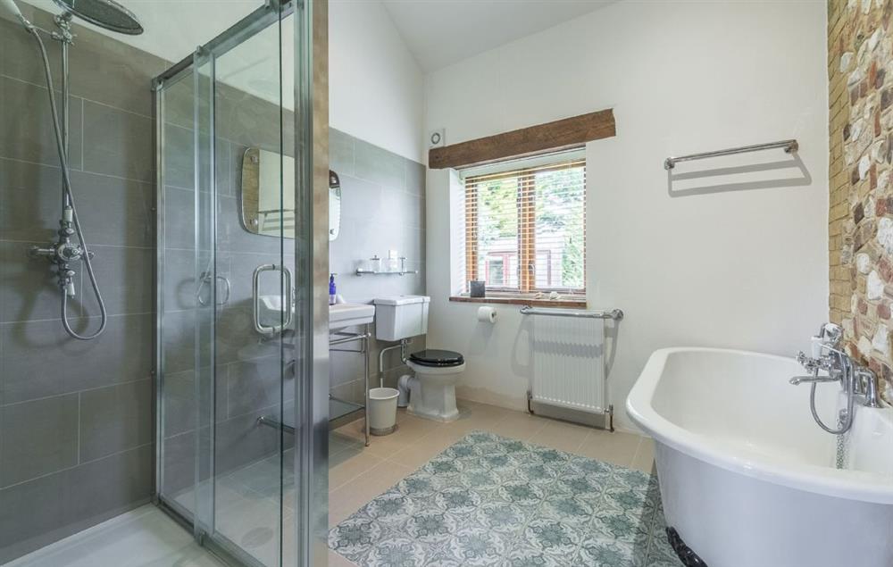En-suite bathroom with roll top bath and separate walk in shower at The Old Foundry, Eastmoor