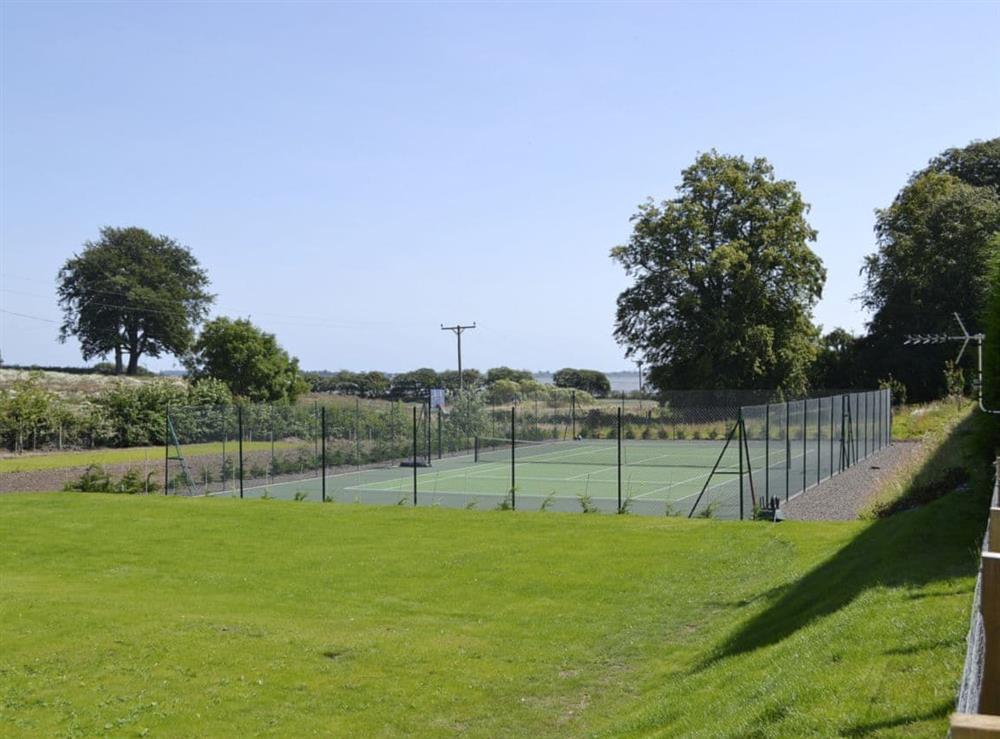 Shared hard tennis court at The Old Gas Works Building in Montrose, Angus