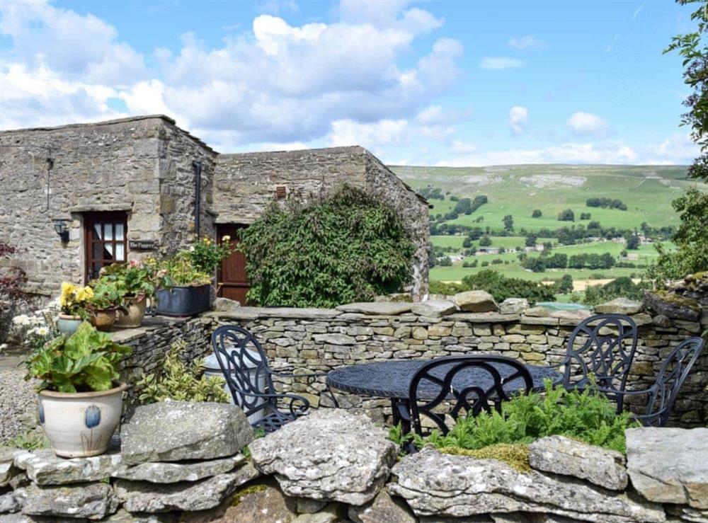 Enclosed garden boasting wonderful views at The Old Goat House in Thornton Rust, Leyburn, North Yorkshire