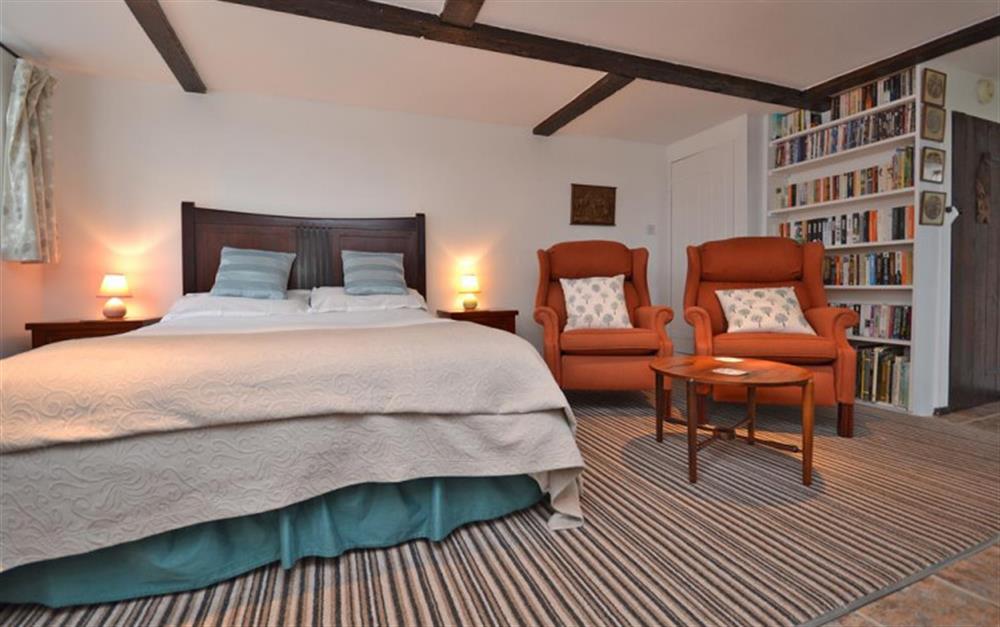 Bedroom and seating at The Old Granary at Kinkell Cottage in Bashley