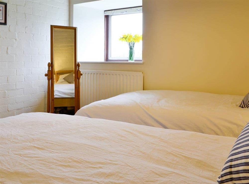 Comfortable twin bedroom at The Old Granary in Holy Island, near Berwick-upon-Tweed, Northumberland