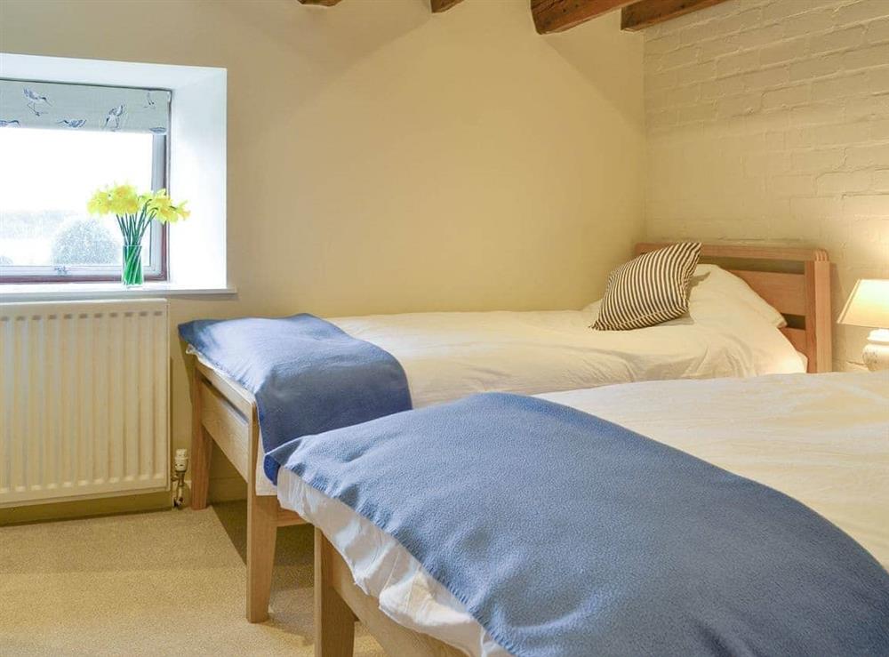 Good-sized second twin bedroom at The Old Granary in Holy Island, near Berwick-upon-Tweed, Northumberland