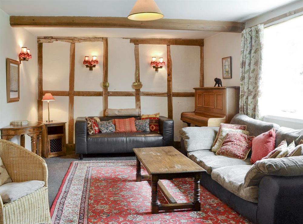 Comfy seating in living room at The Old Granary in Newent, Gloucester, Gloucestershire