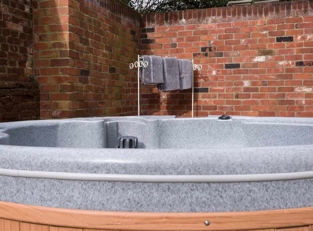 Private hot tub at The Old Hall Coach House in Tacolneston, near Wymondham, Norfolk