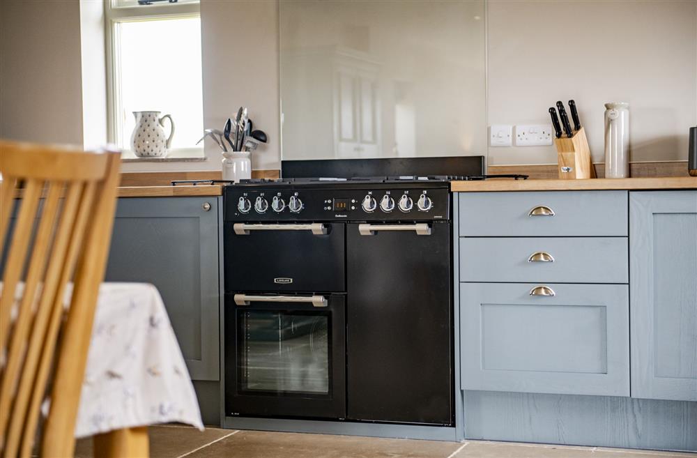 Kitchen featuring  an electric range oven with gas hob at The Old Hay Barn, Barnard Castle