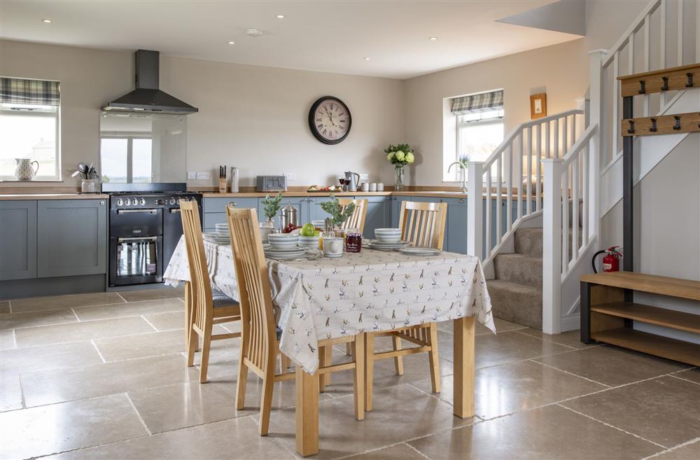 Open-plan kitchen and dining area, the perfect space for  a family meal at The Old Hay Barn, Barnard Castle