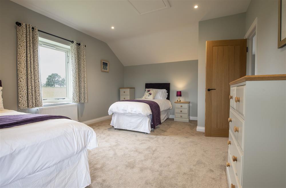 Spacious bedroom two overlooking the views that surround the barn at The Old Hay Barn, Barnard Castle