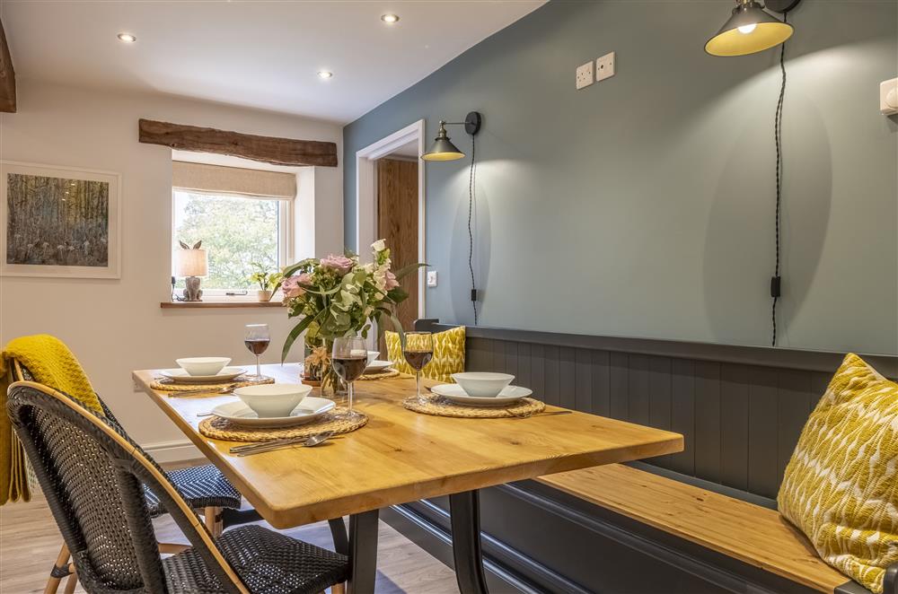 The dining area, with seating for up to six guests  at The Old Hen Shed, Buxton