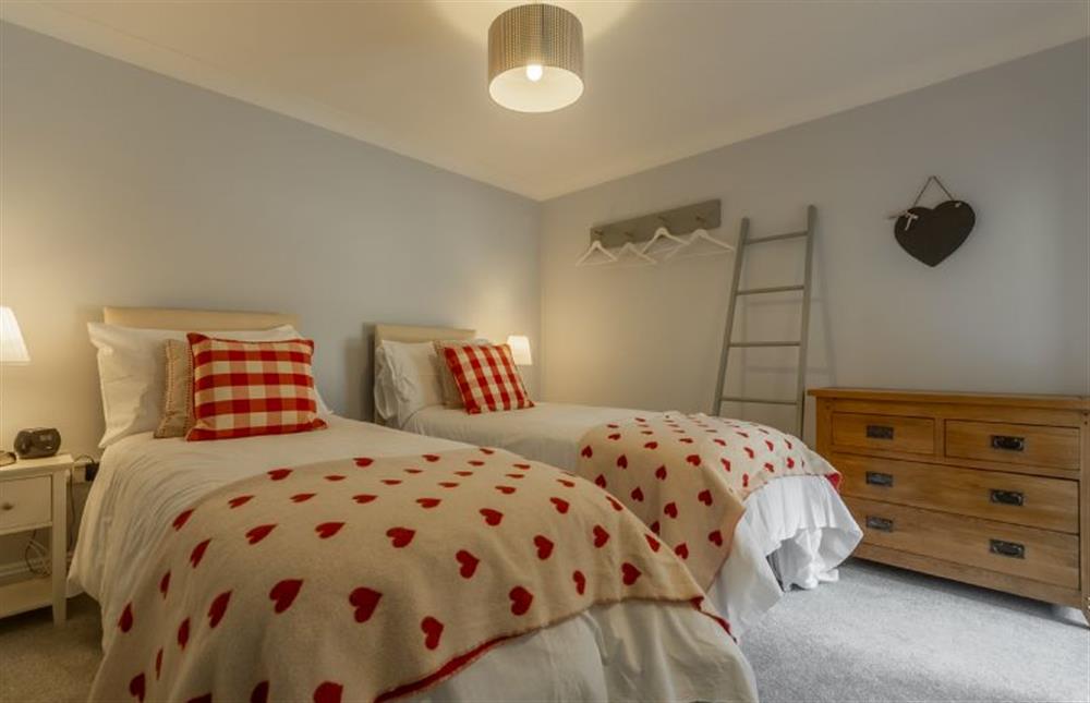 Ground floor:  Bedroom two with  chest of drawers and hanging rail at The Old Joinery, Cley-next-the-Sea near Holt