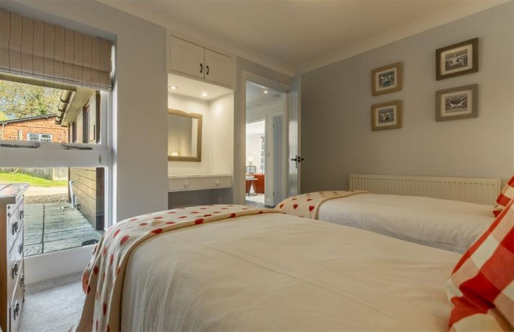 Ground floor:  Bedroom two with full height windows at The Old Joinery, Cley-next-the-Sea near Holt