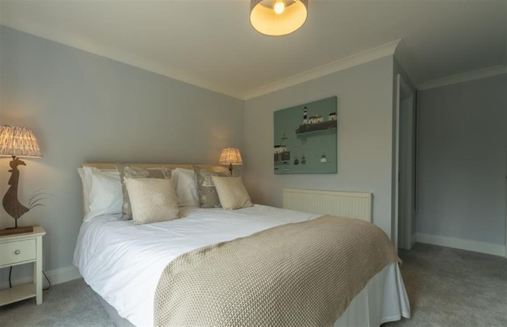 Ground floor:  Master bedroom with a super king-size bed at The Old Joinery, Cley-next-the-Sea near Holt
