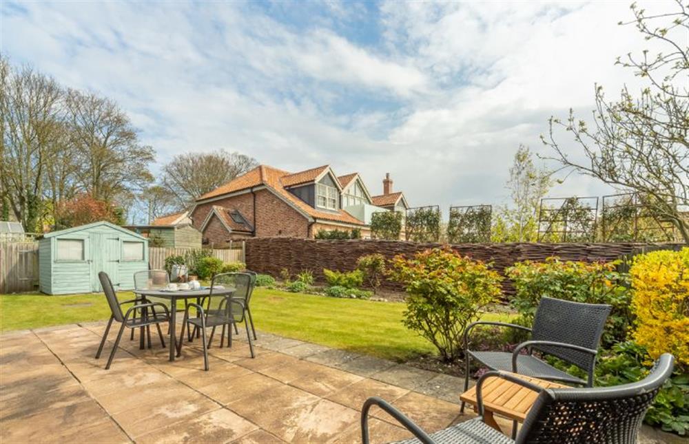 Rear Garden:  With patio and lawned area at The Old Joinery, Cley-next-the-Sea near Holt
