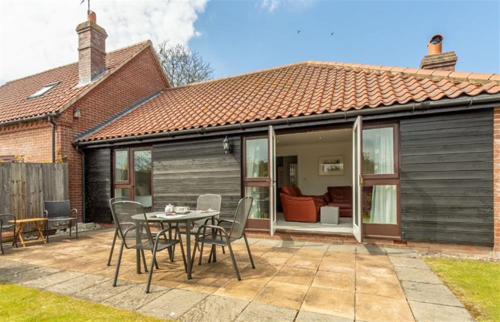 Rear Garden:  With patio area at The Old Joinery, Cley-next-the-Sea near Holt