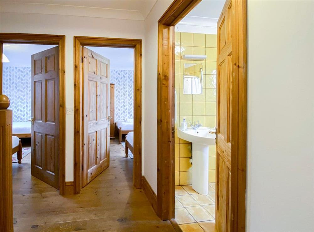Ground floor hallway leading to two twin bedrooms and bathroom at Sweet Coppin, 