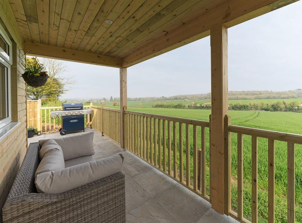 Shaded terrace with rural views at The Old Kennels in Tibberton, near Gloucester, Gloucestershire