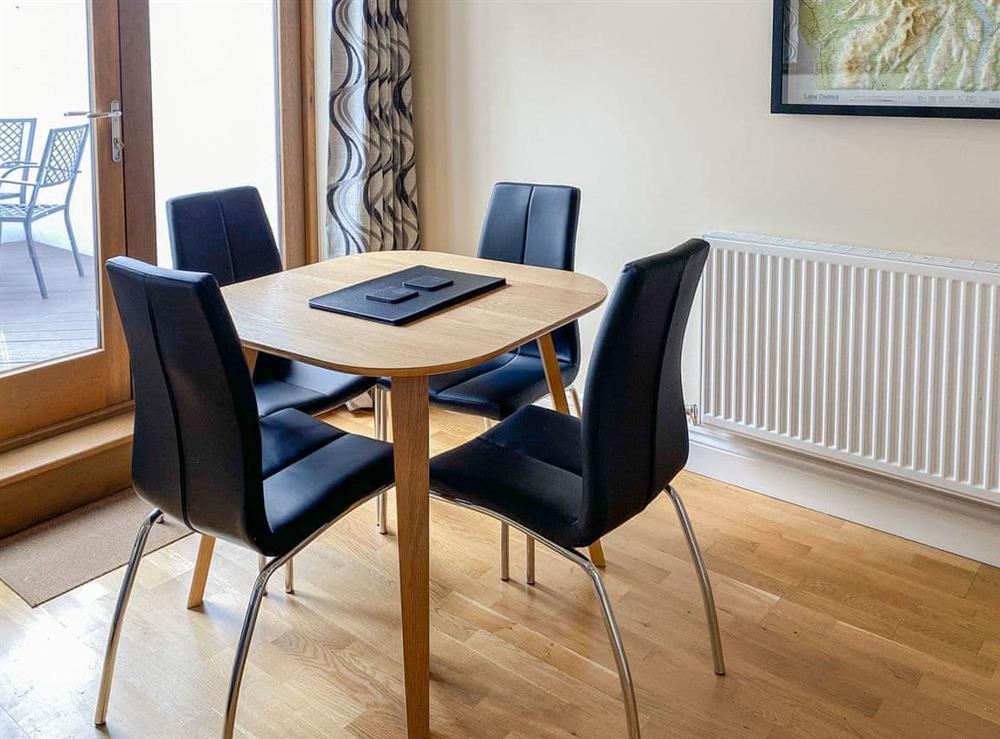 Dining room area with easy access to the patio for al fresco dining at The Old Laundry 4 in Keswick, Cumbria