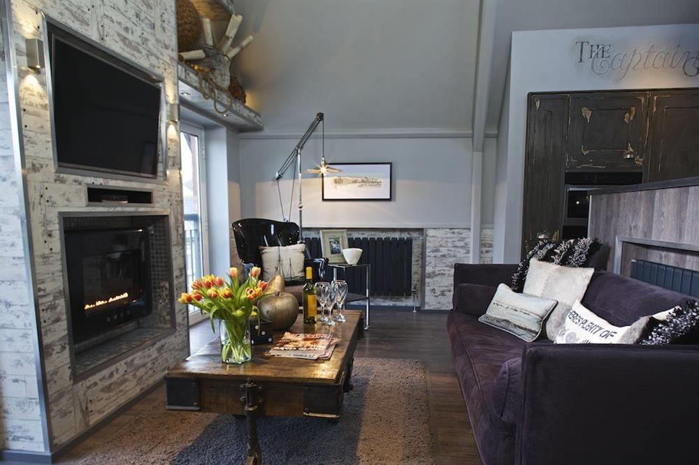 Cosy lounge area with Smeg fire and Smart TV at The Old Library in , Dartmouth