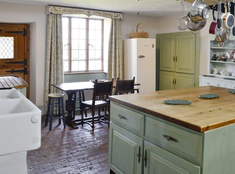 Characterful kitchen with informal dining area at The Old Manor in Dunster, near Minehead, Somerset