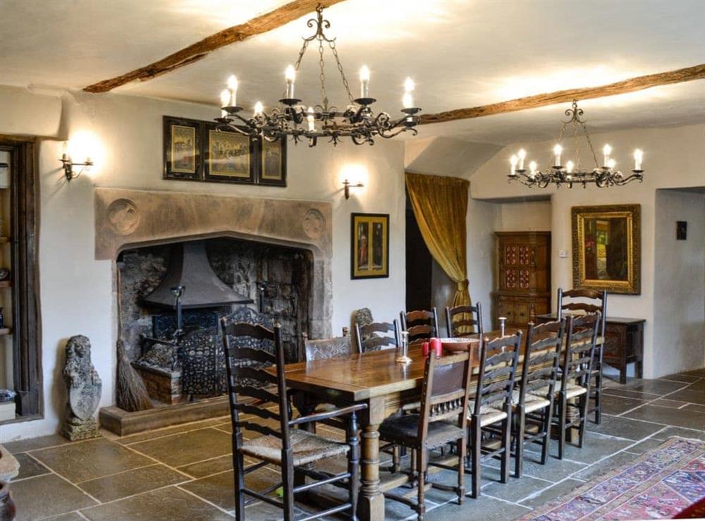 Dining room with slate floor at The Old Manor in Dunster, near Minehead, Somerset