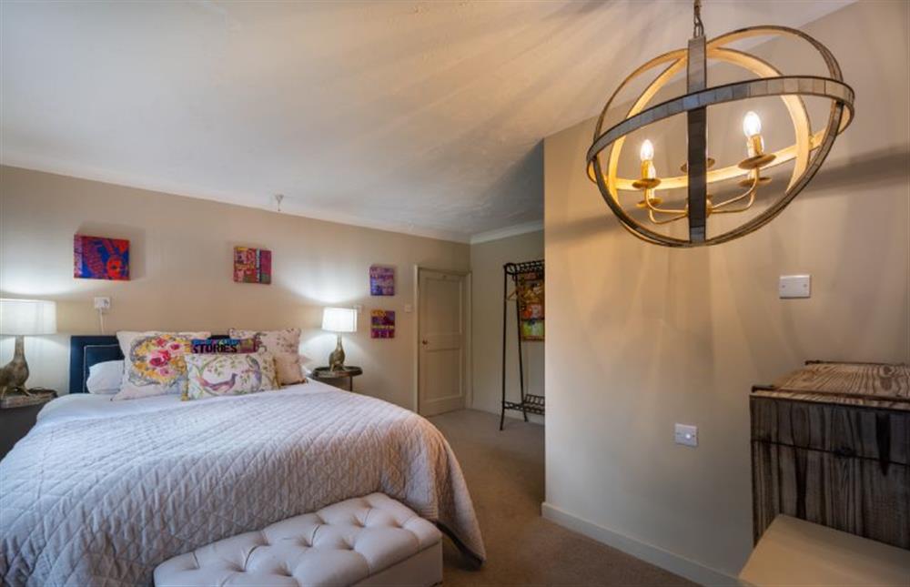 Bedroom two has king-size bed and en-suite shower room at The Old Manor House, Brancaster near Kings Lynn