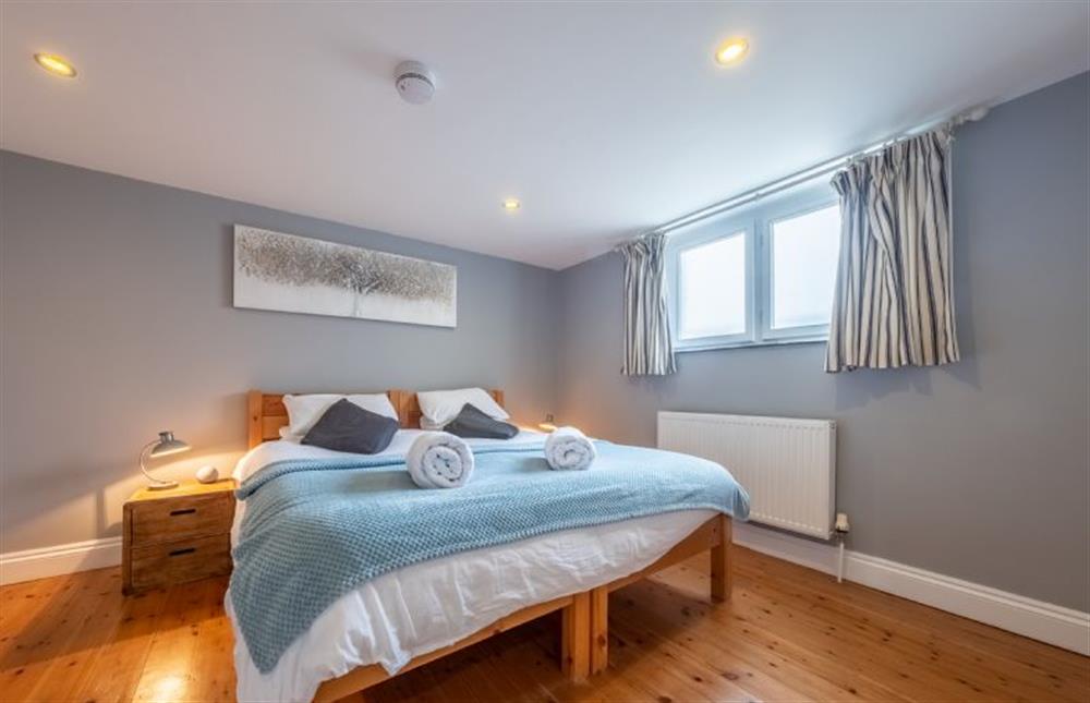 Bedroom four with a zip-and-link super-king bed at The Old Methodist Chapel, Heacham near Kings Lynn