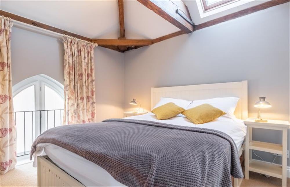 Master bedroom with overhead and side windows at The Old Methodist Chapel, Heacham near Kings Lynn
