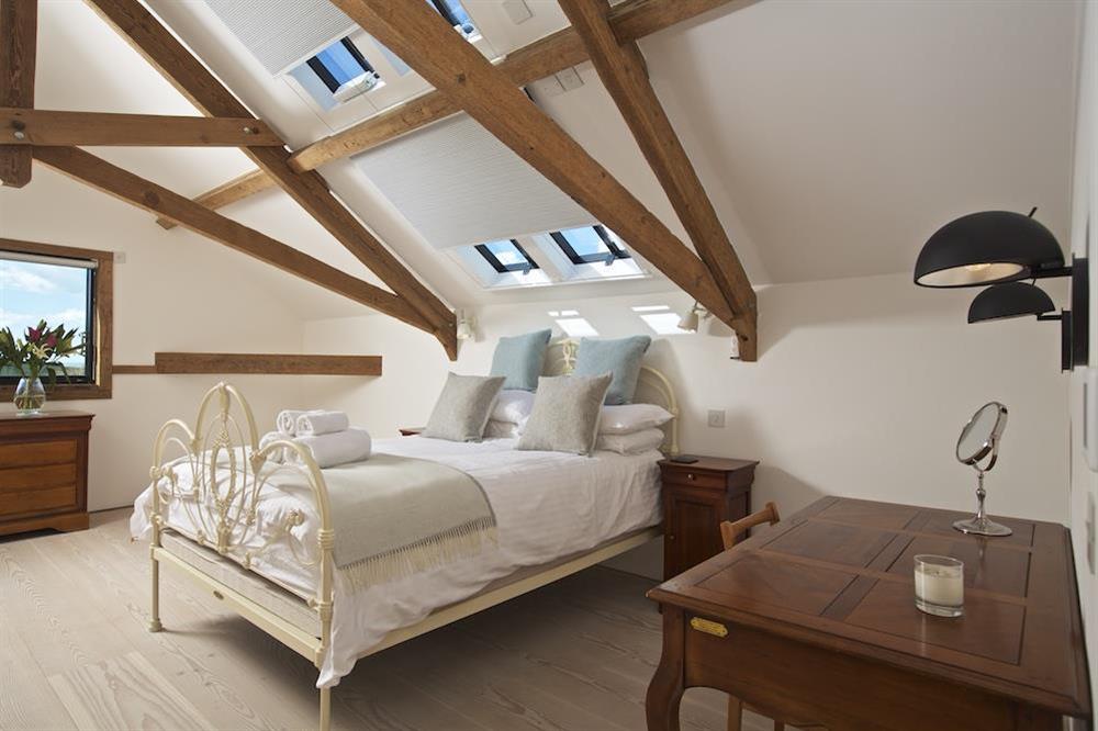 En suite bedroom with king-size bed at The Old Milking Shed in , Bantham