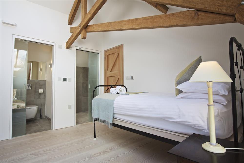 First floor level, bedroom with King-size bed at The Old Milking Shed in , Bantham