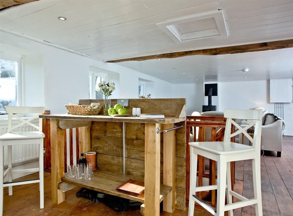 Breakfast bar within the open-plan living space at The Old Mill in Egloskerry, near Launceston, Cornwall