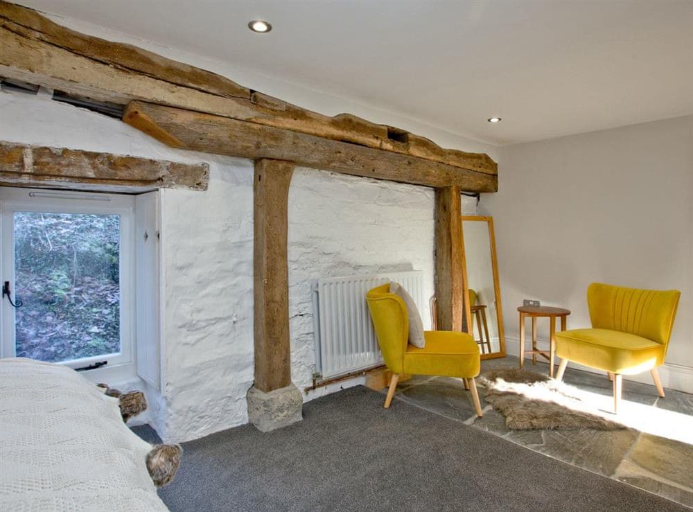 Good-sized double bedroom with seating area at The Old Mill in Egloskerry, near Launceston, Cornwall