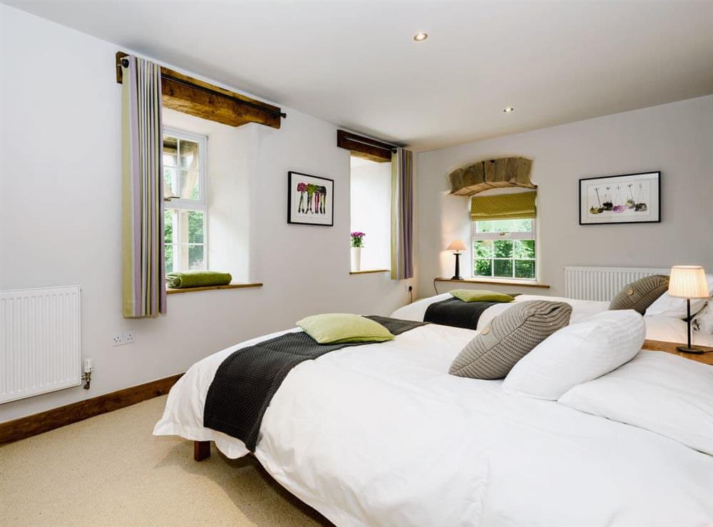 Comfortable bedroom with two double beds (photo 2) at The Old Mill in Penrith, Cumbria