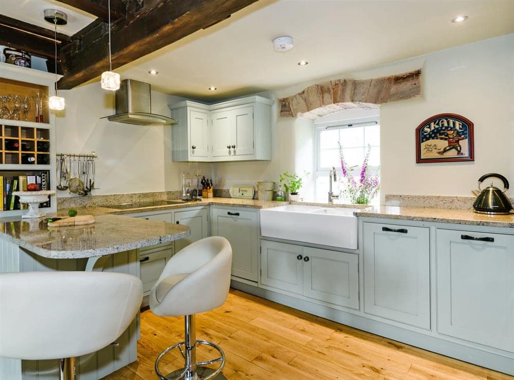 Designer kitchen with breakfast bar at The Old Mill in Penrith, Cumbria