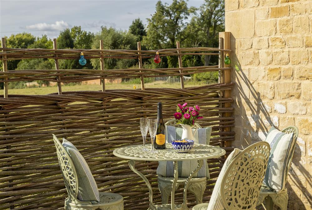 Enjoy an Aperitif on the pretty rear patio at The Old Mission Church, Paxford, near Chipping Campden